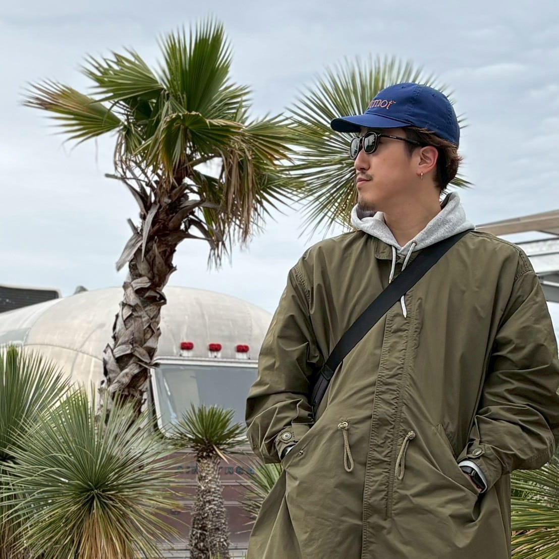 morita — オリーブコートのレイヤードスタイル